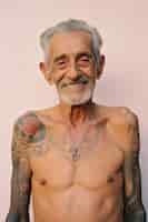 Free photo portrait of man with body tattoos