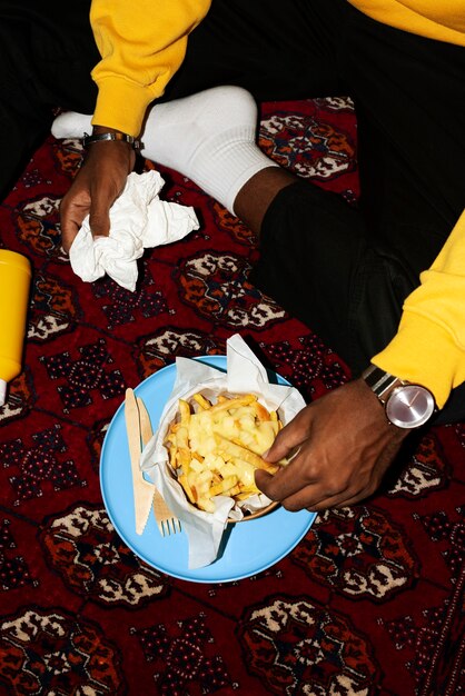 Portrait of man with a dish of poutine