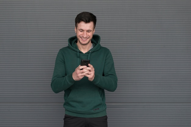 Free photo portrait man with green hoodie