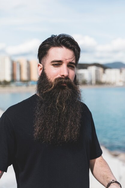 Portrait of a man with long beard at outdoors