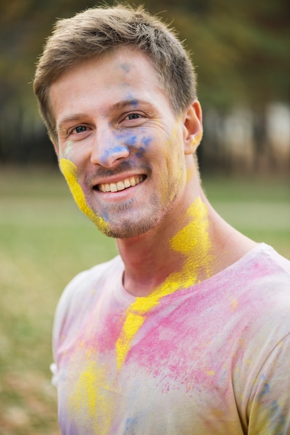 Portrait of man with multicolored face