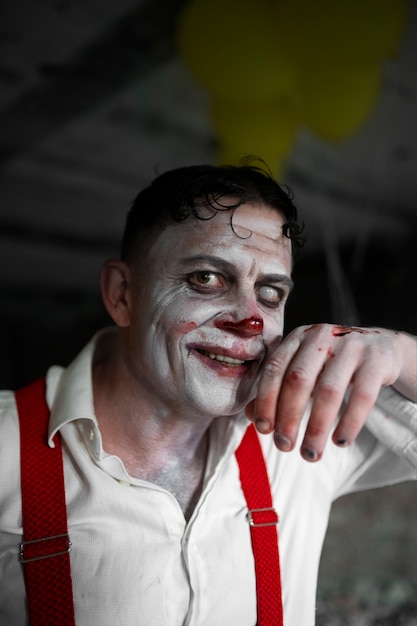 Portrait of man with scary clown make-up