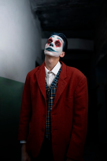 Free photo portrait of man with scary clown make-up