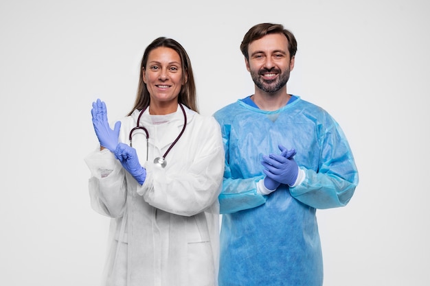 Portrait of man and woman wearing medical gowns