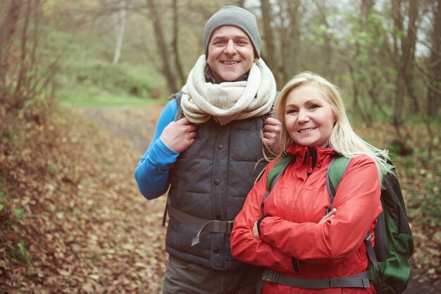 Portrait of man and woman while hiking