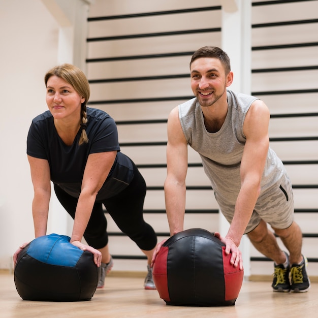 Portrait of man and woman working out