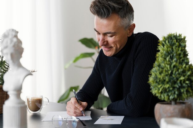 Portrait man writing letter