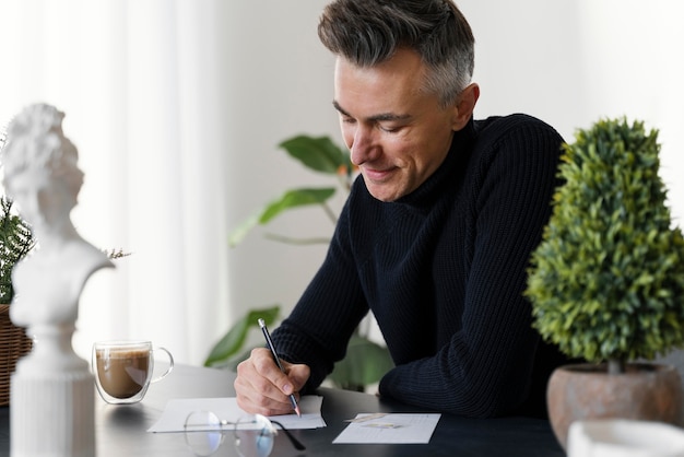 Portrait man writing letter