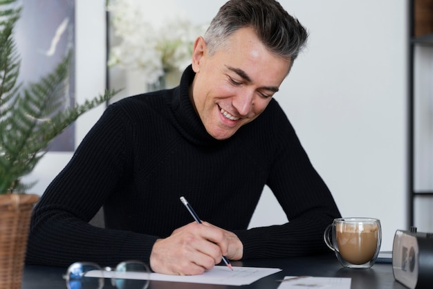 Free photo portrait man writing letter