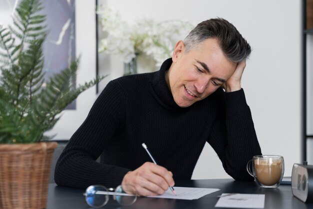 portrait man writing letter