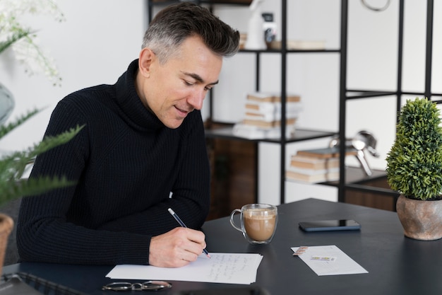 portrait man writing letter