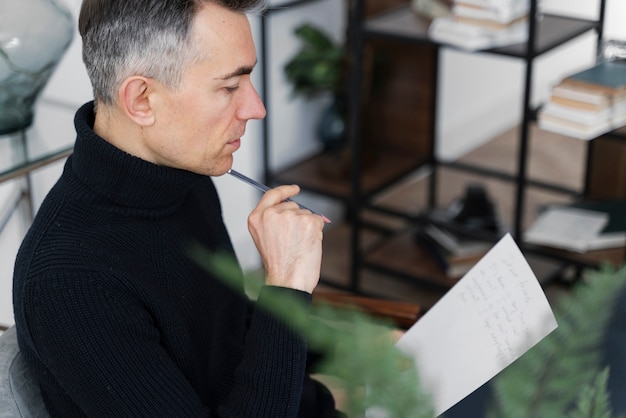 Portrait man writing letter