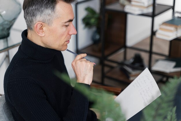 portrait man writing letter