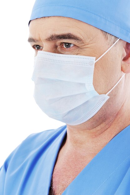 Portrait of mature male doctor surgeon with mask on his face