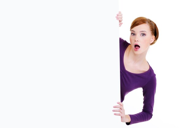 Portrait of an mazed look of woman looks out because of an blank billboard