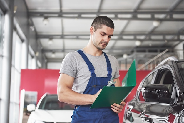 Portrait of a mechanic at work in his garage