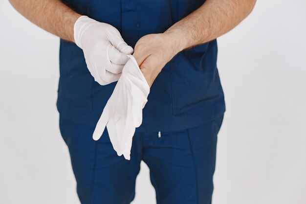 A portrait of a medical doctor posing against white background