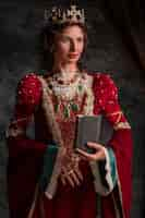 Free photo portrait of medieval queen with manuscript