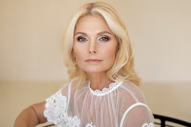 Portrait of middle-aged blonde rich woman