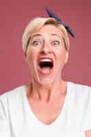 Free photo portrait of middle aged woman screaming
