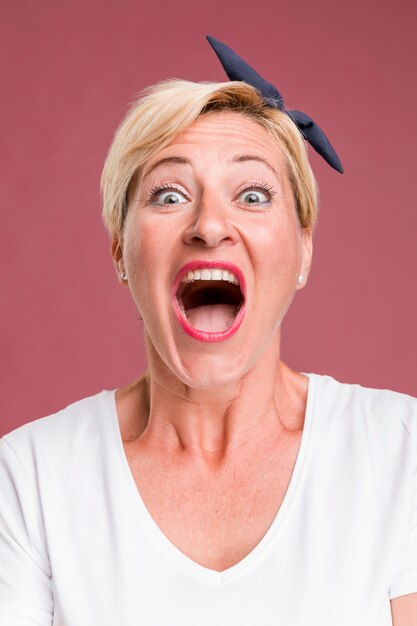 Portrait of middle aged woman screaming