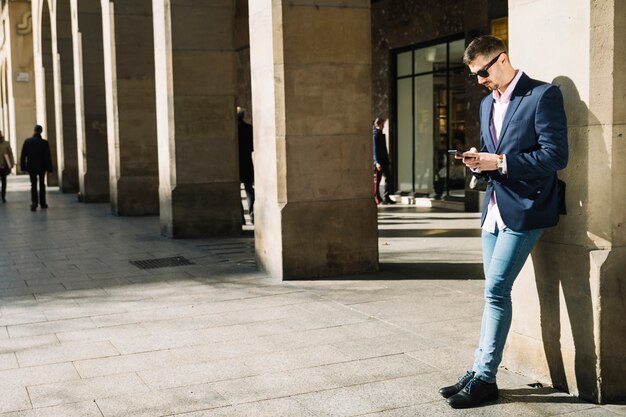 Portrait of modern businessman outdoors