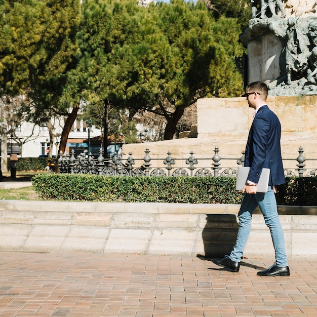 Portrait of modern businessman outdoors