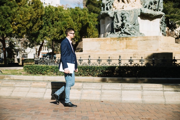 Portrait of modern businessman outdoors