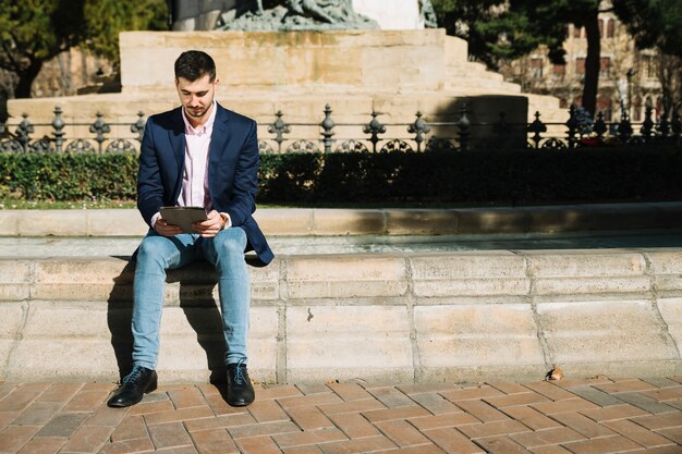 Portrait of modern businessman outdoors