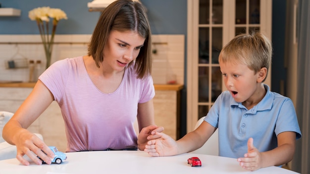 Portrait of mother playing with son