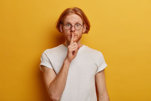 Portrait of mysterious teenager has bob hairstyle, ginger beard