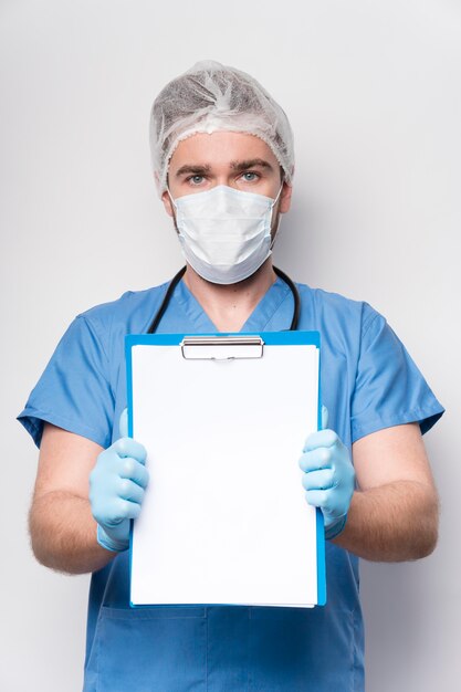 Portrait of nurse holding clipboard