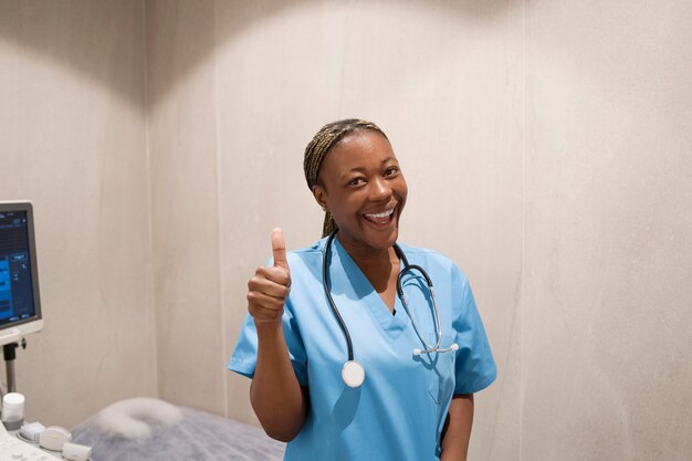 Portrait of nurse in scrubs at the clinic