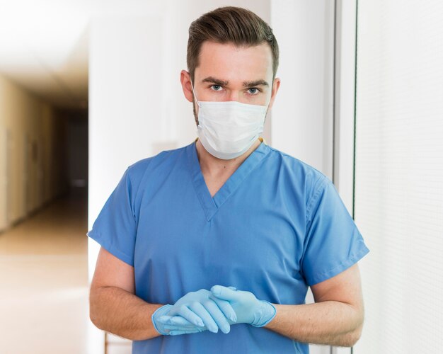 Portrait of nurse wearing mask and gloves