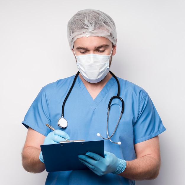 Portrait of nurse writing medical notes