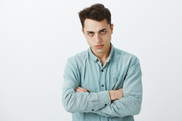 Free photo portrait of offended pissed off european man in shirt
