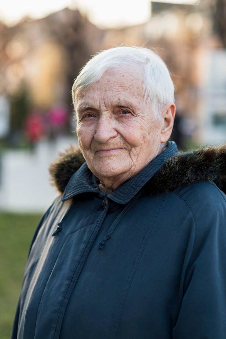 Free Photo portrait of older woman in the city
