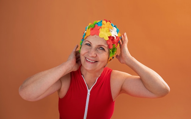 Portrait of older woman with floral swim cap