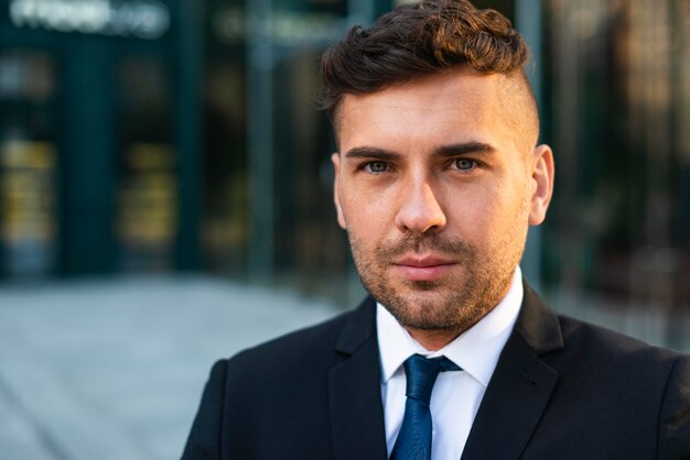 Portrait of outdoor businessman