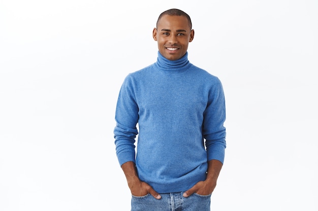 Portrait of outgoing good-looking african american guy with bristle, blue turtleneck
