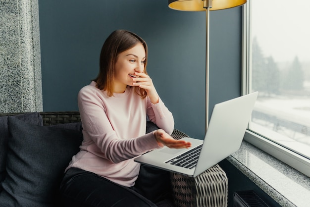 Portrait of overjoyed woman expressing happiness completing project successfully 