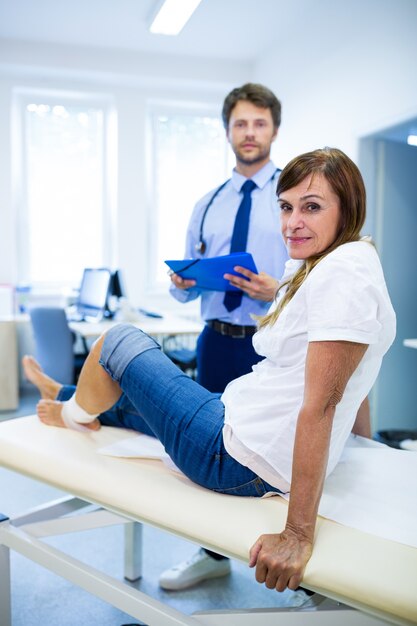 Portrait of patient and doctor looking at camera