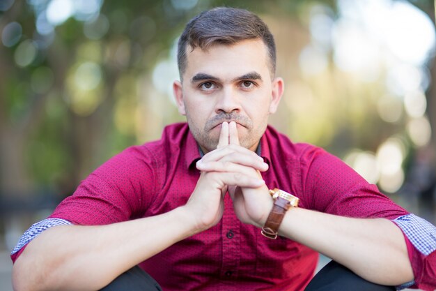 Portrait of pensive businessman touching lips