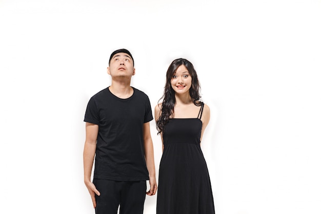 Portrait of pensive Korean couple isolated on white