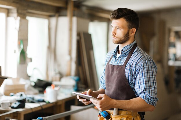 Portrait of pensive woodworker