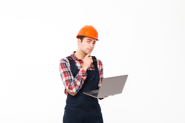 Portrait of a pensive young male builder