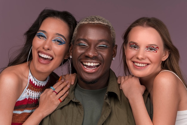 Free photo portrait of people wearing graphic eye makeup