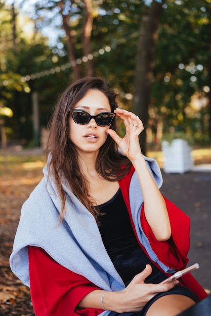 Portrait photo of a young girl with a smartphone