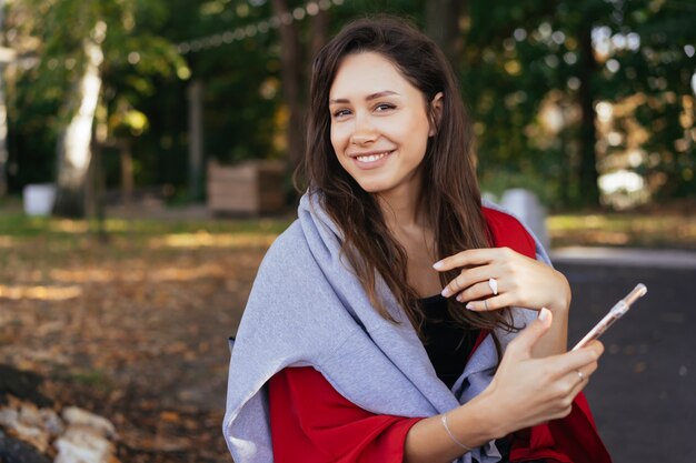 Portrait photo of a young girl with a smartphone