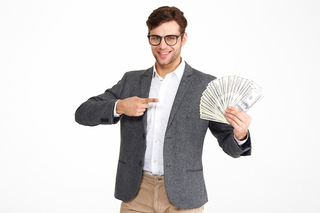 Portrait of pleased young man in eyeglasses and a jacket